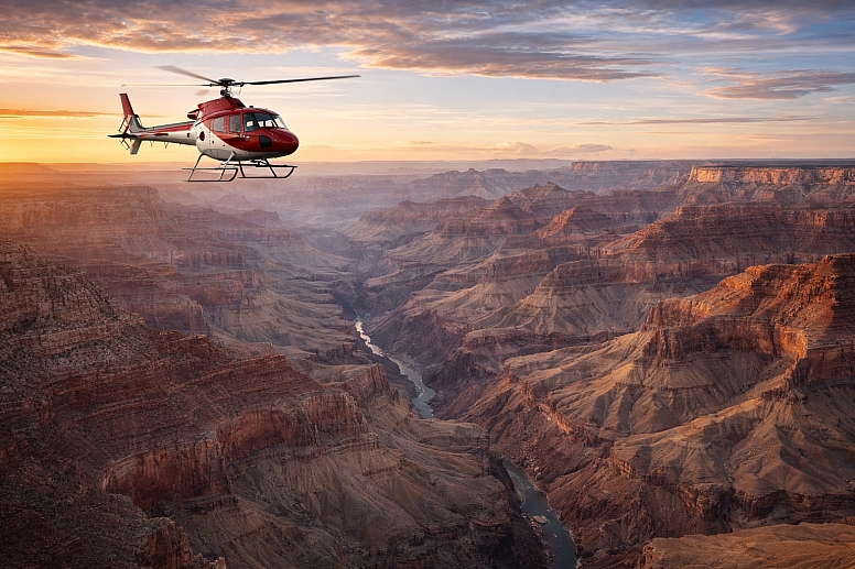 helicopter over the grand canyon at sunset